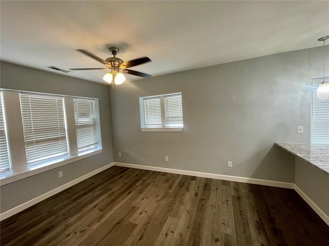 2715 Arkansas Ave, Saint Louis, MO 63118 - unfurnished room with dark wood-style flooring, ceiling fan, and baseboards