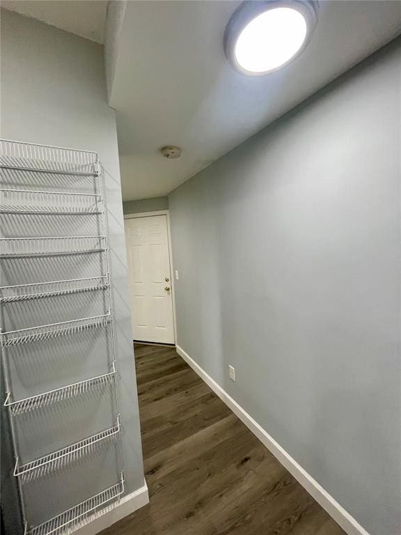 2715 Arkansas Ave, Saint Louis, MO 63118 - hall with baseboards and dark wood finished floors