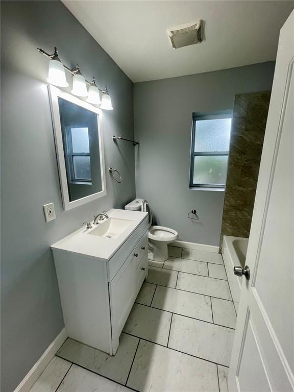 2715 Arkansas Ave, Saint Louis, MO 63118 - full bathroom featuring marble finish floors, baseboards, toilet, and vanity