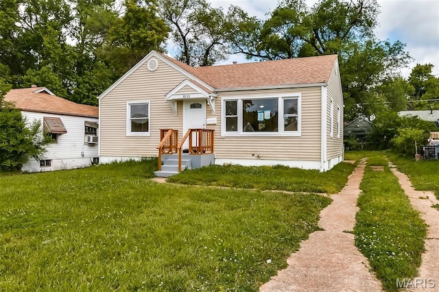 8115 Myrick St, Berkeley, MO 63134 - view of front of home featuring a front lawn and a shingled roof