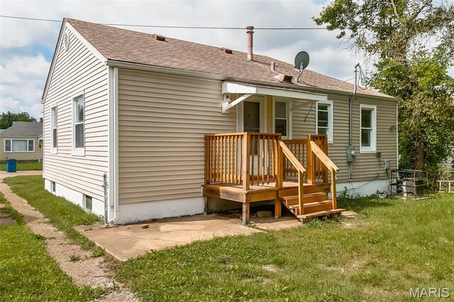 8115 Myrick St, Berkeley, MO 63134 - back of property with a lawn and a shingled roof
