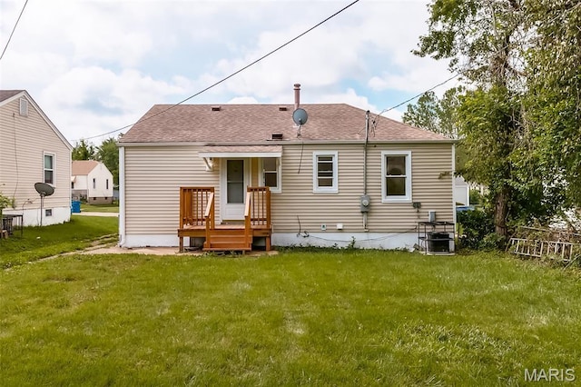 8115 Myrick St, Berkeley, MO 63134 - rear view of house featuring a yard and roof with shingles