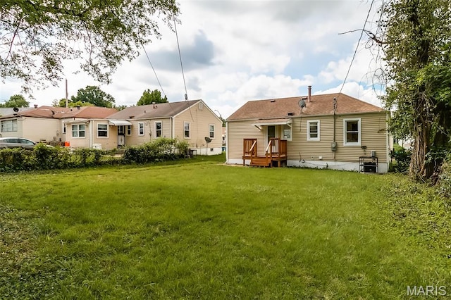 8115 Myrick St, Berkeley, MO 63134 - back of house featuring a yard
