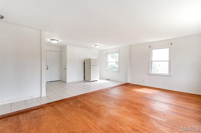 8115 Myrick St, Berkeley, MO 63134 - empty room featuring light wood-type flooring and baseboards