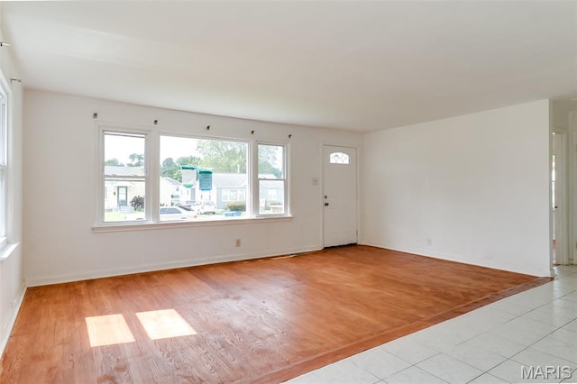 8115 Myrick St, Berkeley, MO 63134 - entryway featuring light wood-style floors and baseboards