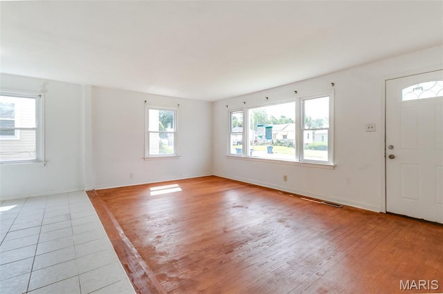8115 Myrick St, Berkeley, MO 63134 - entryway featuring light wood finished floors and baseboards
