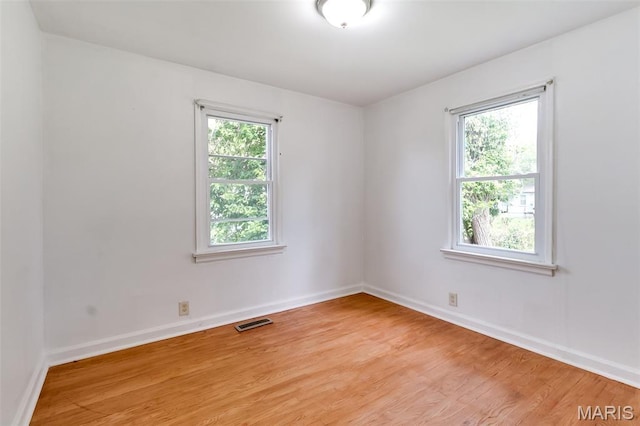 8115 Myrick St, Berkeley, MO 63134 - empty room with light wood-style floors and baseboards