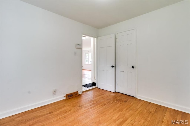 8115 Myrick St, Berkeley, MO 63134 - unfurnished bedroom with light wood finished floors and baseboards