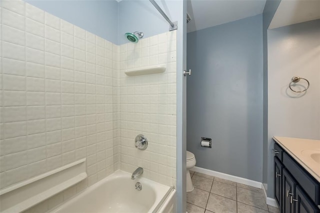 full bathroom featuring  shower combination, tile patterned floors, vanity, toilet, and baseboards