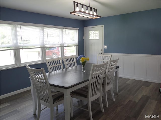 127 E 2nd St, De Soto, MO 63020 - dining area with wood finished floors and wainscoting