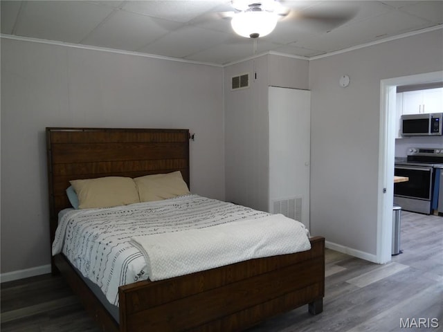 127 E 2nd St, De Soto, MO 63020 - bedroom with light wood-type flooring and ornamental molding
