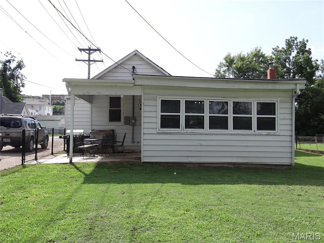 127 E 2nd St, De Soto, MO 63020 - rear view of house featuring a patio