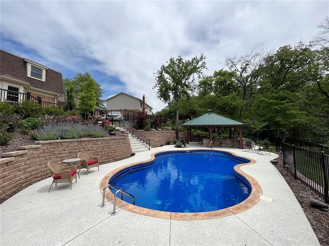 view of swimming pool featuring stairs, a gazebo, a patio, and fence