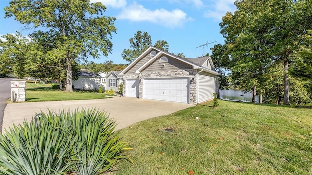 view of front of house with concrete driveway, stone siding, a front lawn, and a garage