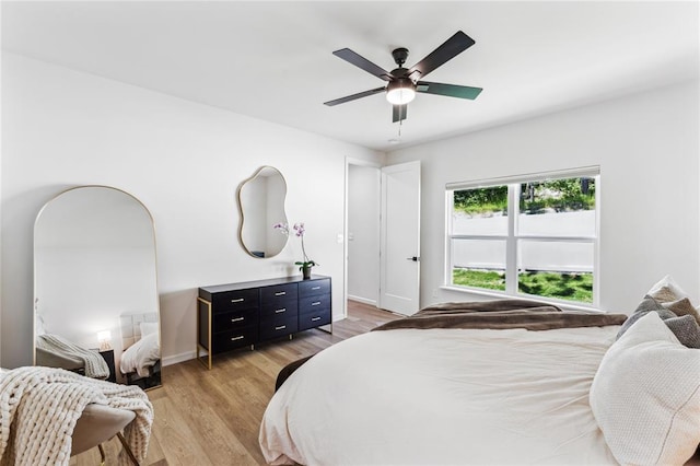 1513 Grey Wolf Dr, Imperial, MO 63052 - bedroom with light wood-type flooring, baseboards, and ceiling fan