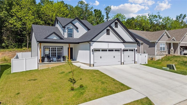 1513 Grey Wolf Dr, Imperial, MO 63052 - view of front facade featuring a garage, concrete driveway, and roof with shingles