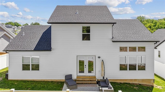 1513 Grey Wolf Dr, Imperial, MO 63052 - rear view of property with french doors, entry steps, a shingled roof, and a lawn