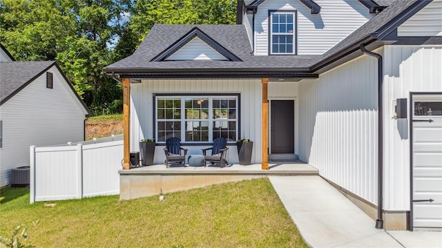 1513 Grey Wolf Dr, Imperial, MO 63052 - entrance to property with covered porch, roof with shingles, and central AC unit