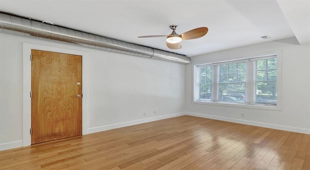 4220 Mcpherson Unit 101, Saint Louis, MO 63108 - empty room featuring ceiling fan, light wood-style floors, and baseboards