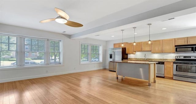 4220 Mcpherson Unit 101, Saint Louis, MO 63108 - kitchen featuring stainless steel appliances, baseboards, light wood-style floors, and recessed lighting