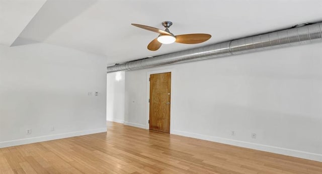 4220 Mcpherson Unit 101, Saint Louis, MO 63108 - empty room featuring a ceiling fan, baseboards, and wood finished floors