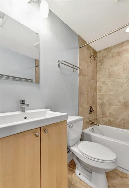4220 Mcpherson Unit 101, Saint Louis, MO 63108 - full bathroom featuring toilet, vanity, bathing tub / shower combination, and tile patterned flooring