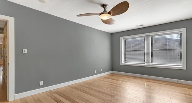4220 Mcpherson Unit 101, Saint Louis, MO 63108 - empty room with ceiling fan, baseboards, and light wood-type flooring