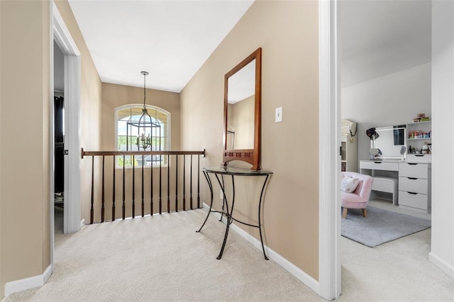 2 Autumn Bluffs Ct, Fenton, MO 63026 - hallway featuring carpet flooring, baseboards, a chandelier, and an office area