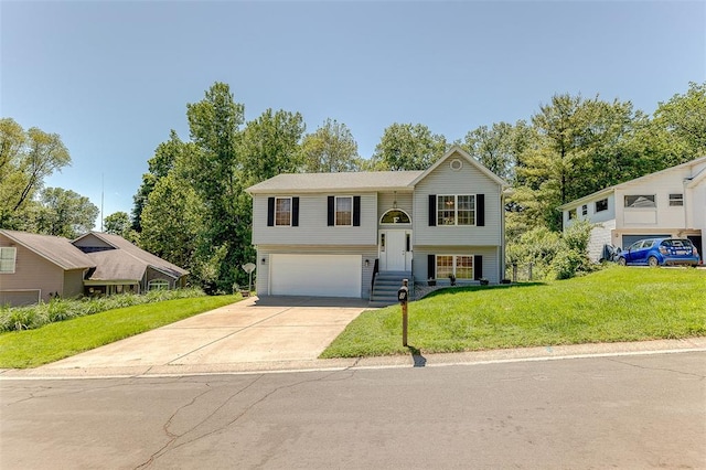 8 Lavadna Ct, Collinsville, IL 62234 - split foyer home with an attached garage, driveway, and a front yard