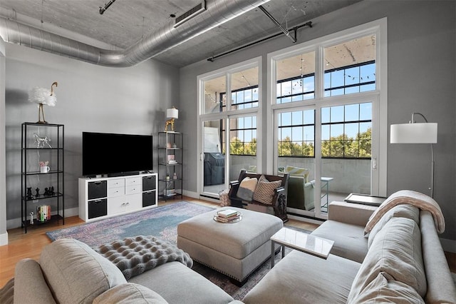 4100 Forest Park Ave Unit 323, Saint Louis, MO 63108 - living room with light wood finished floors and baseboards