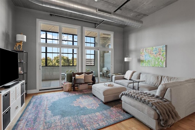 4100 Forest Park Ave Unit 323, Saint Louis, MO 63108 - living room with wood finished floors