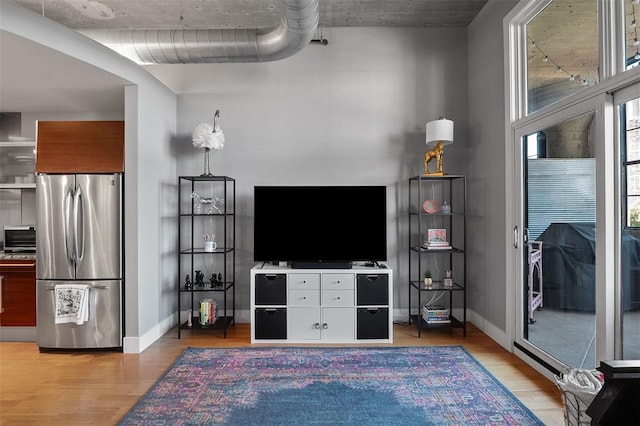 4100 Forest Park Ave Unit 323, Saint Louis, MO 63108 - living room with light wood-style floors and baseboards