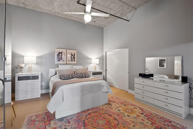 4100 Forest Park Ave Unit 323, Saint Louis, MO 63108 - bedroom featuring a high ceiling and a ceiling fan