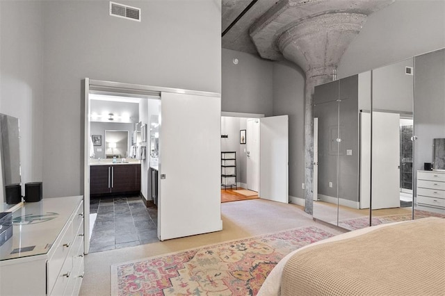 4100 Forest Park Ave Unit 323, Saint Louis, MO 63108 - bedroom with a high ceiling