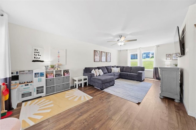 224 Quiet Bend Dr, Wentzville, MO 63385 - living room featuring a ceiling fan and wood finished floors