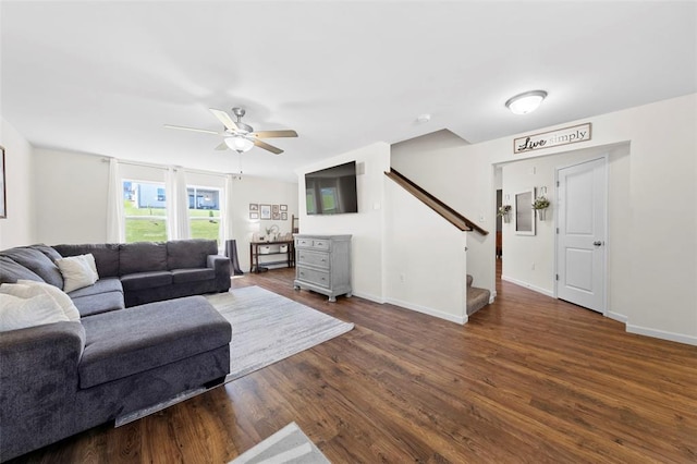 224 Quiet Bend Dr, Wentzville, MO 63385 - living area with a ceiling fan, stairs, dark wood-style floors, and baseboards