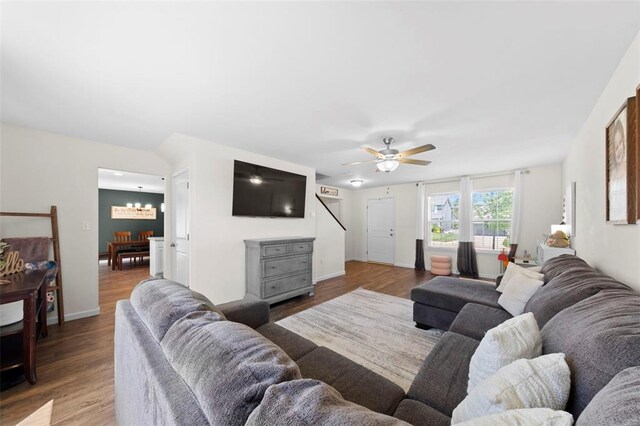 224 Quiet Bend Dr, Wentzville, MO 63385 - living area with a chandelier, wood finished floors, ceiling fan, and baseboards