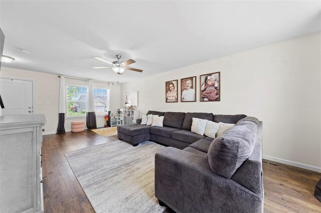 224 Quiet Bend Dr, Wentzville, MO 63385 - living room featuring a ceiling fan, wood finished floors, and baseboards