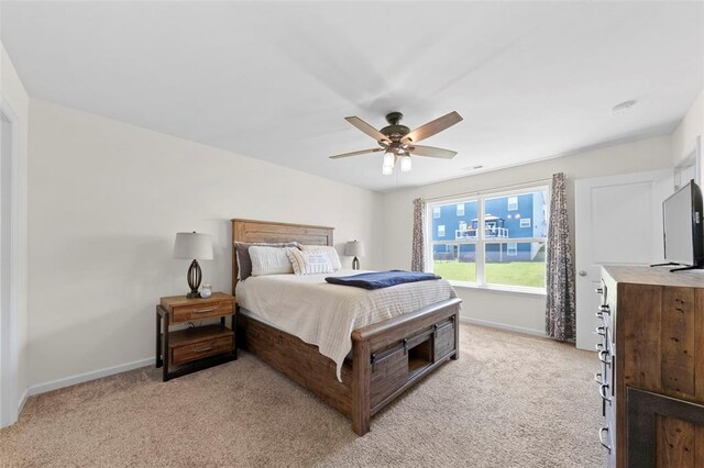 224 Quiet Bend Dr, Wentzville, MO 63385 - bedroom with light colored carpet, baseboards, and ceiling fan
