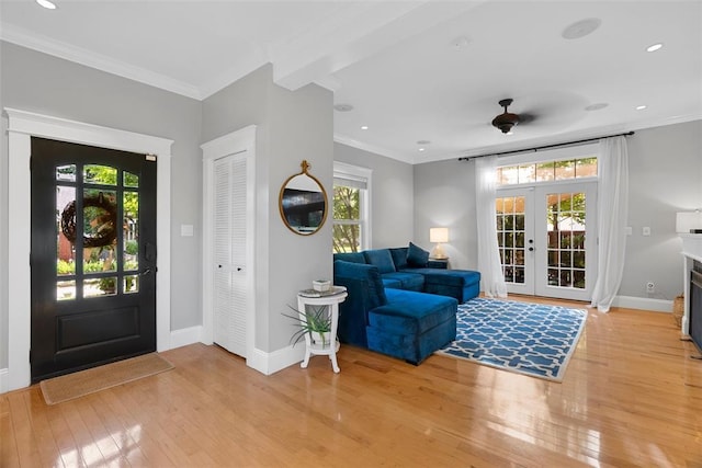 entrance foyer with light wood-style flooring, baseboards, french doors, recessed lighting, and crown molding