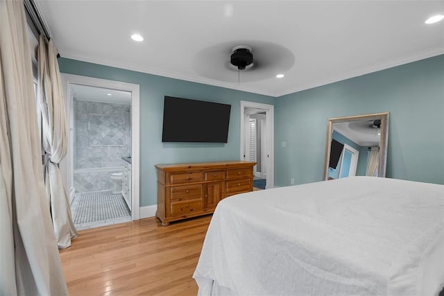 bedroom with light wood finished floors, crown molding, recessed lighting, baseboards, and connected bathroom