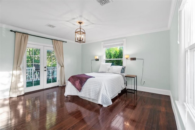 bedroom with french doors, ornamental molding, hardwood / wood-style floors, baseboards, and a chandelier
