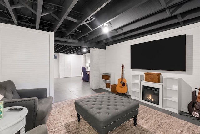 living room with a glass covered fireplace