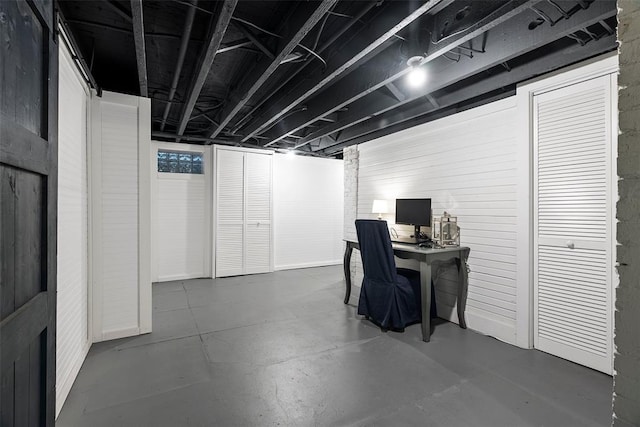 home office featuring finished concrete floors