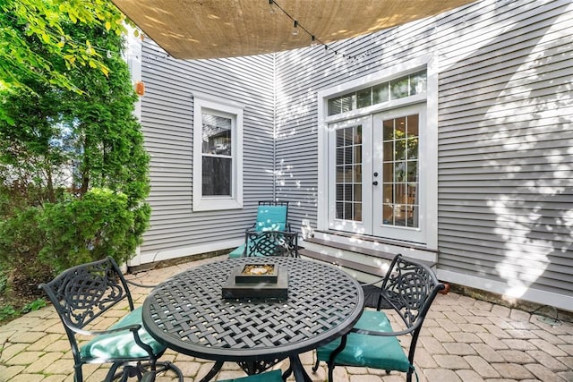 view of patio with a fire pit and french doors