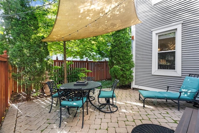 view of patio / terrace with a fenced backyard and outdoor dining space