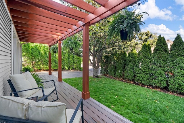 deck with a pergola and a lawn