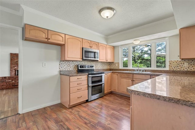 10014 Aldred Dr, Sunset Hills, MO 63128 - kitchen with stainless steel appliances, light brown cabinetry, wood finished floors, backsplash, and crown molding