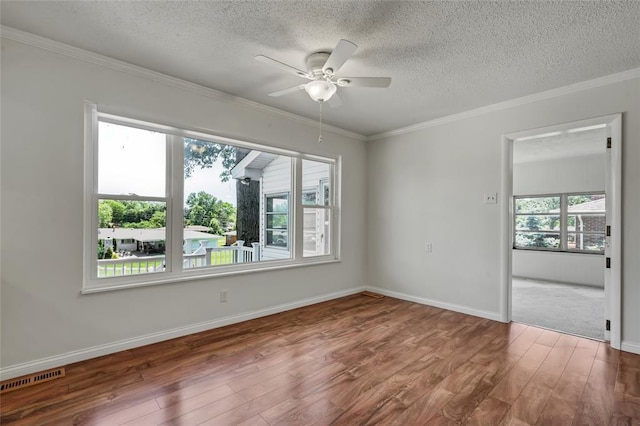 10014 Aldred Dr, Sunset Hills, MO 63128 - spare room featuring wood finished floors, a textured ceiling, a ceiling fan, ornamental molding, and baseboards