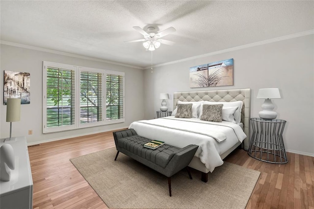 10014 Aldred Dr, Sunset Hills, MO 63128 - bedroom featuring wood finished floors, crown molding, baseboards, a textured ceiling, and ceiling fan